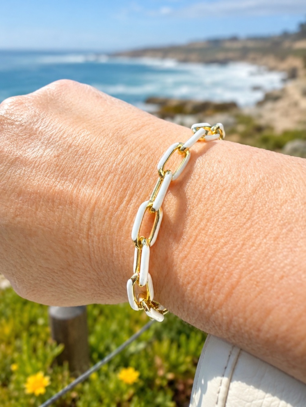 14k gold plated bracelet with white enamel accent and large lobster claw closure